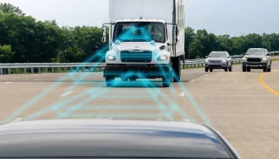 Advanced driving technology visualization on a Freightliner M2 106 Plus driving on a highway with other vehicles