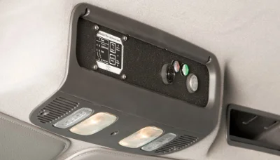 Interior close-up view of Freightliner M2 112 roof console showing control buttons and lighting fixtures