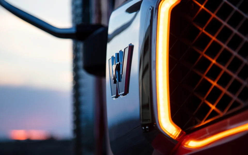 Close-up of illuminated Western Star truck grille and emblem during twilight left, Ottawa Ontario dealership 