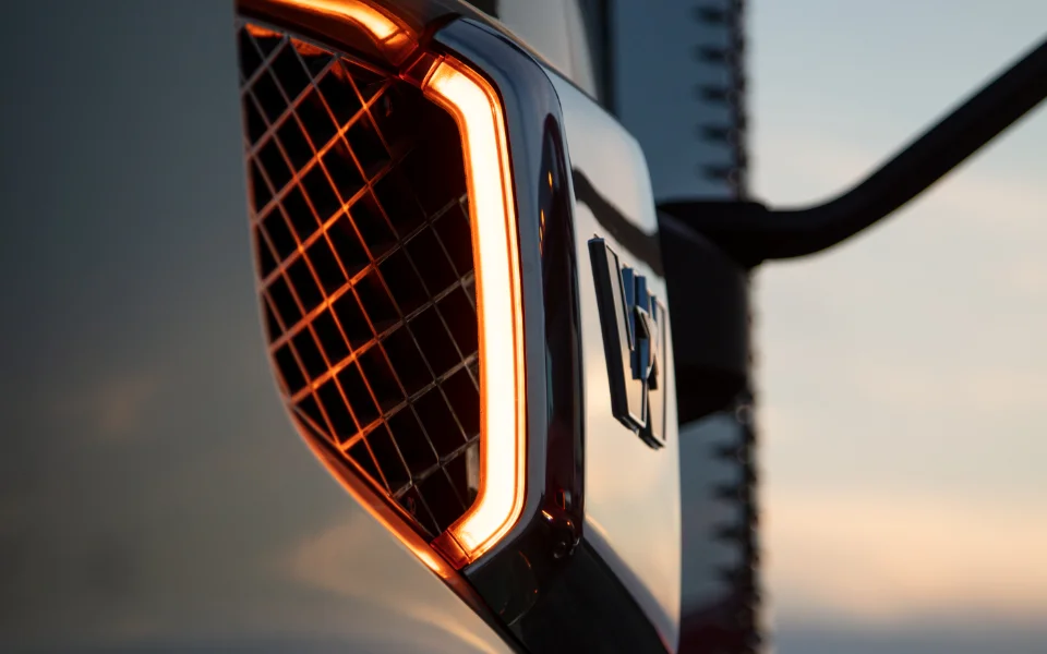 Close-up of illuminated Western Star truck grille and emblem during twilight right, Ottawa Ontario dealership